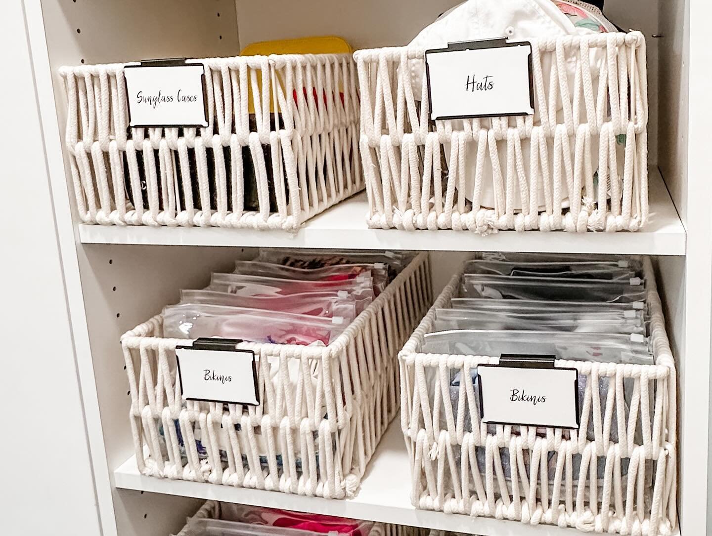 It&rsquo;s great to display everything in your closet, but some items like bathing suits, workout clothes, etc are just hard to keep #organized. Solution: decorative bins with labels that give a hint of what&rsquo;s inside, but still keep items conta