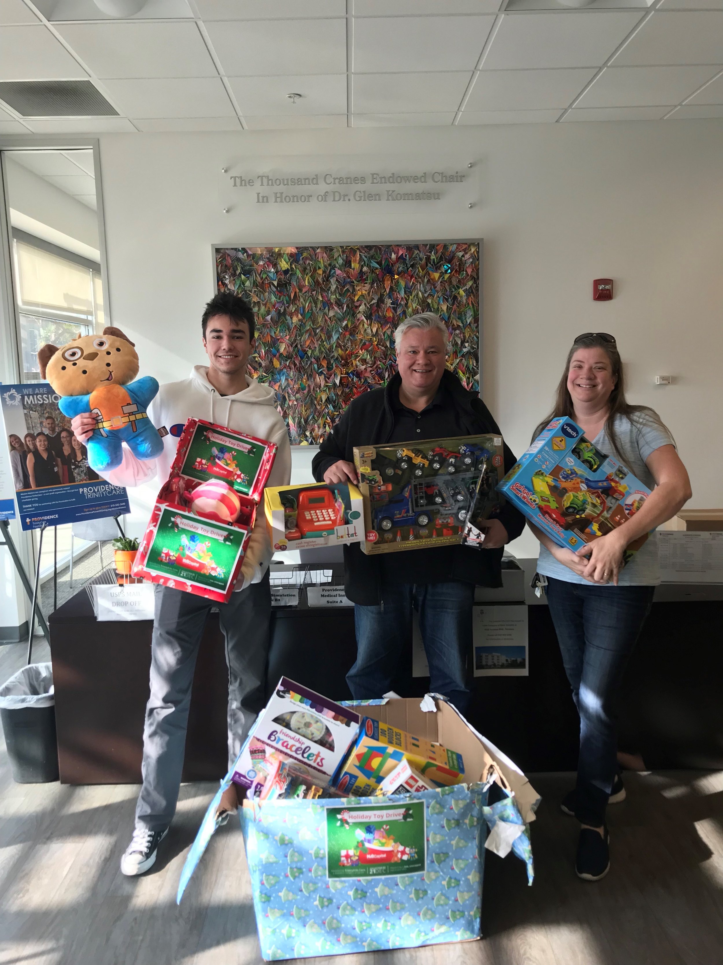  NAI Capital professionals dropping off toy donations. 