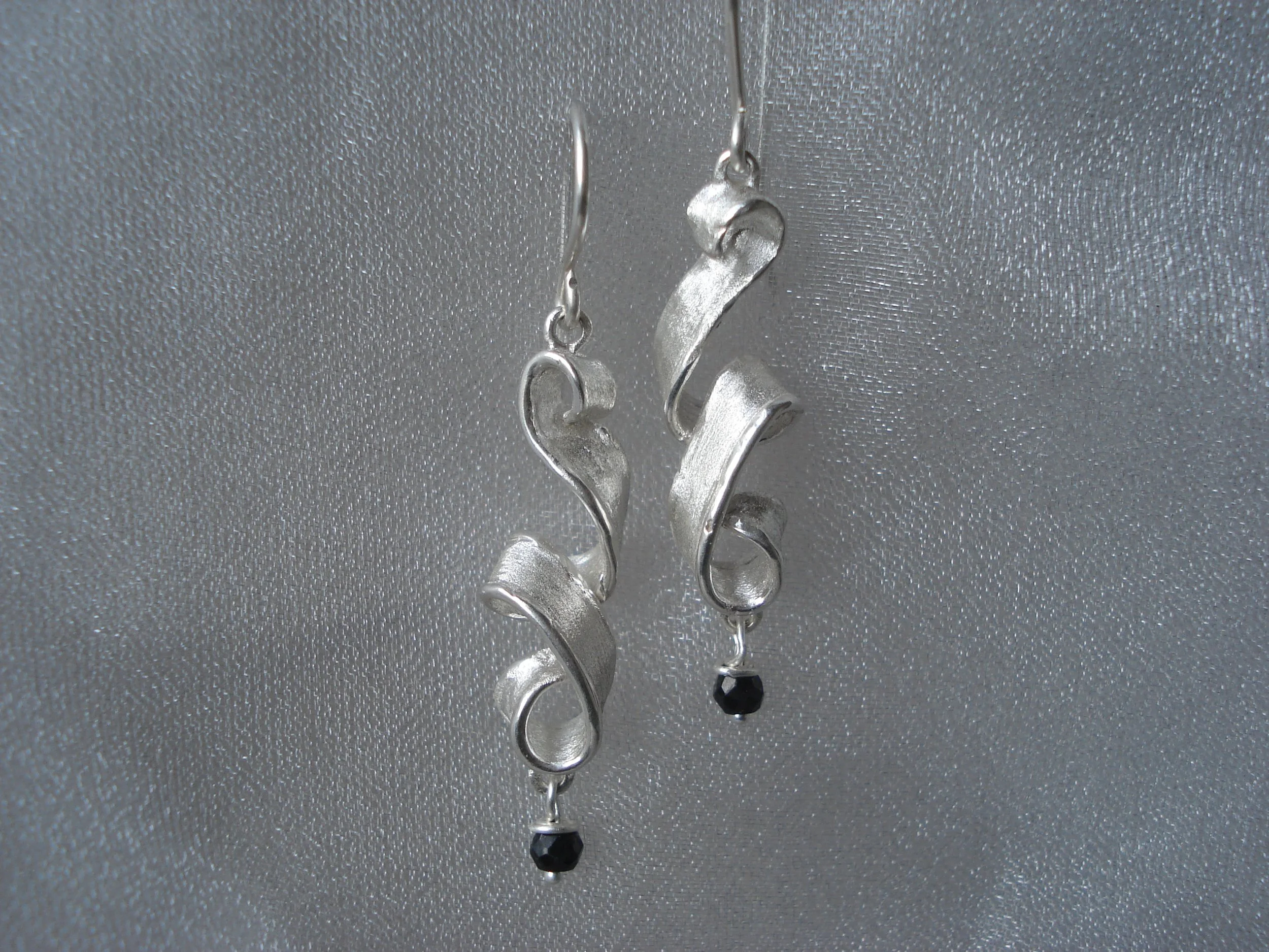  Classy but sassy!! Pictured here with Black Spinel stones (wine red garnet and a few other stones available. Sterling silver, Shimmer texture with shiny edge, French hooks. Length is approximately 1.75” depending on size of pearl or stone. Choose yo