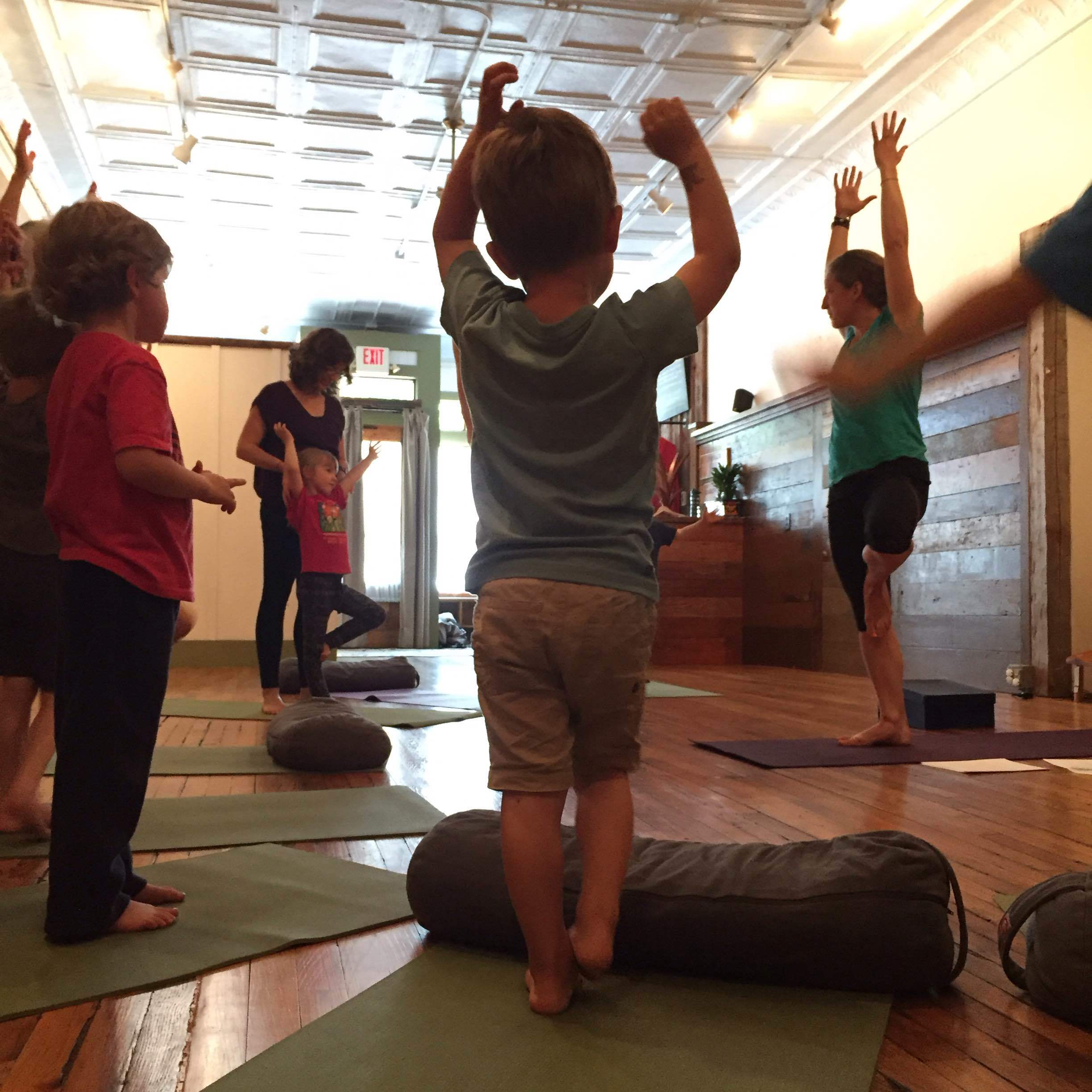 Finding tree pose during the story, Penelope and her Puppy Mind