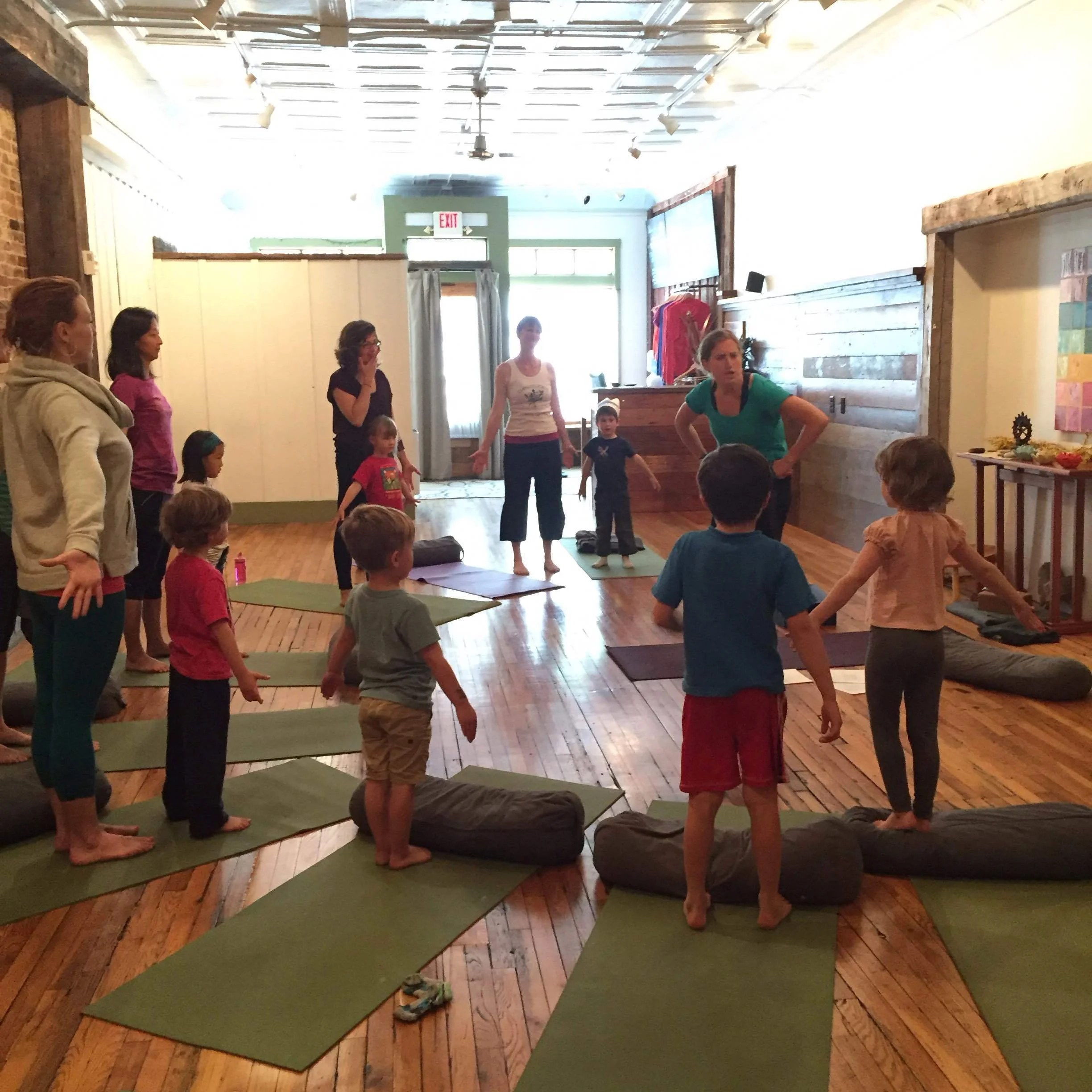 Kids hold mountain pose as I tell them about Penelope's next move