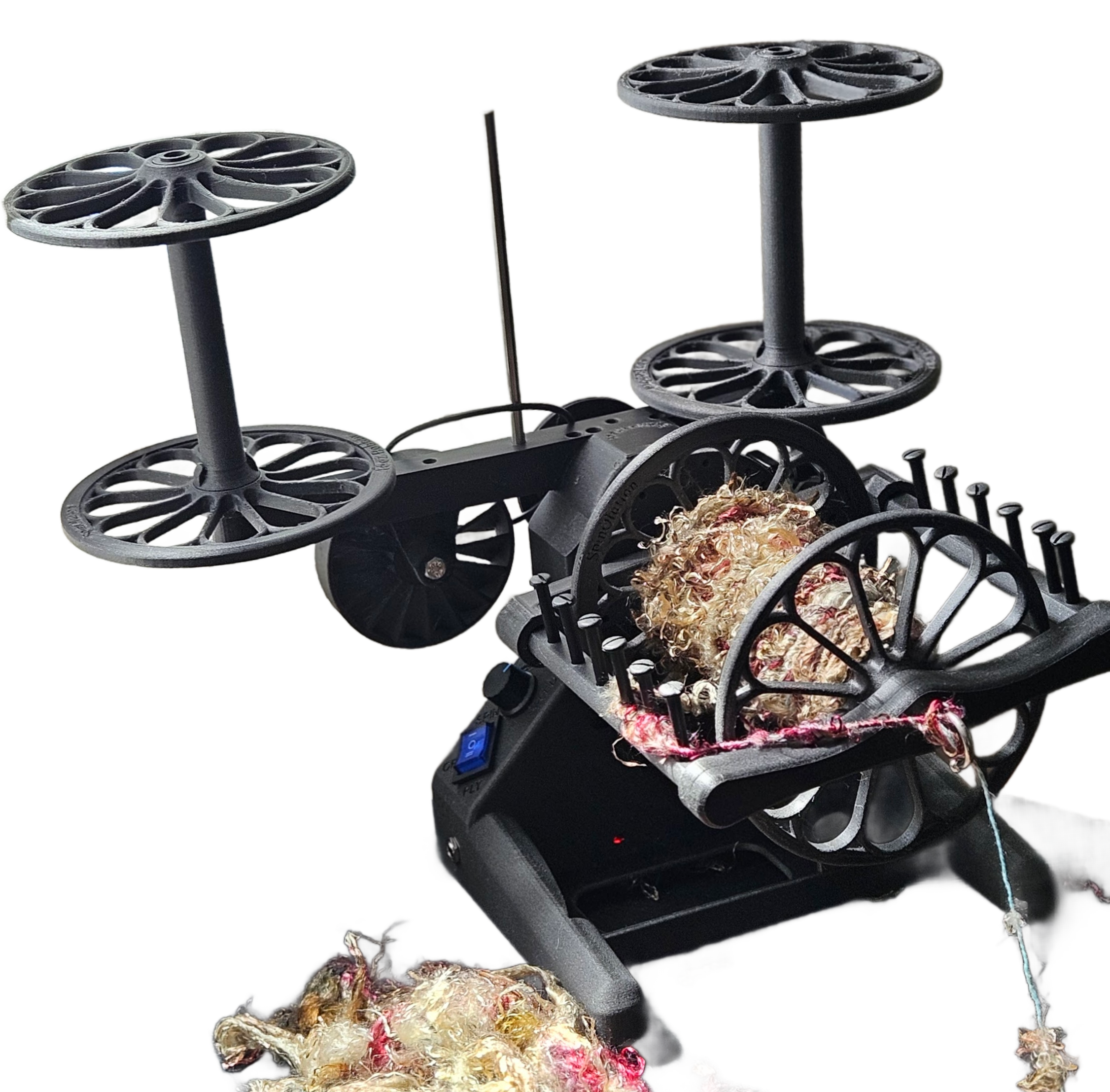 A drone with a manipulator arm grabbing several balls of string or yarn.