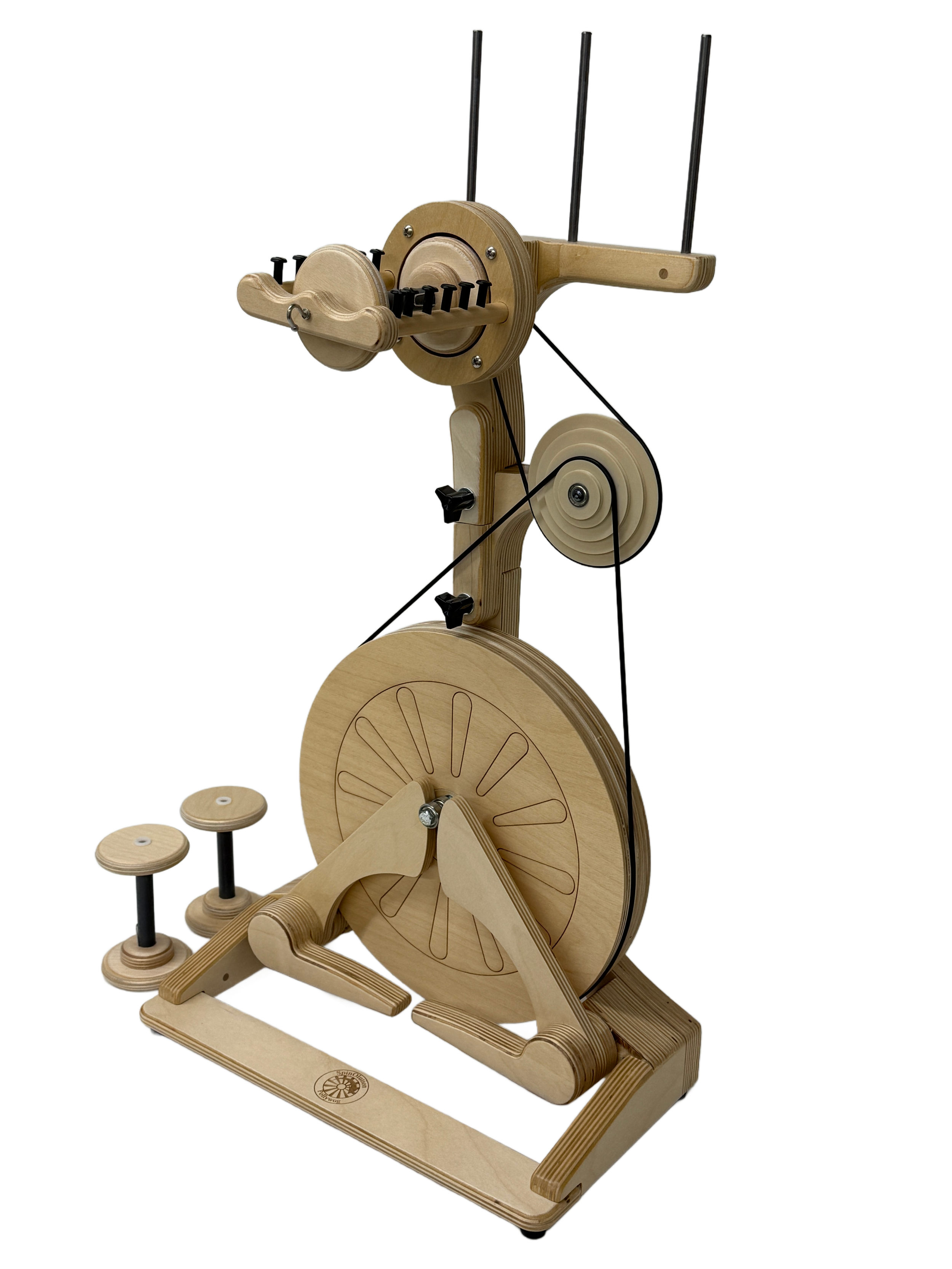 A SpinOlution entry level spinning wheel for spinning yarn made out of Baltic birch,