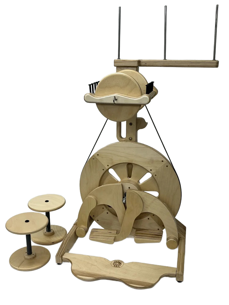 Un assembled wooden Rube Goldberg machine with various wheels, levers, and ramps, accompanied by three small wooden stools.