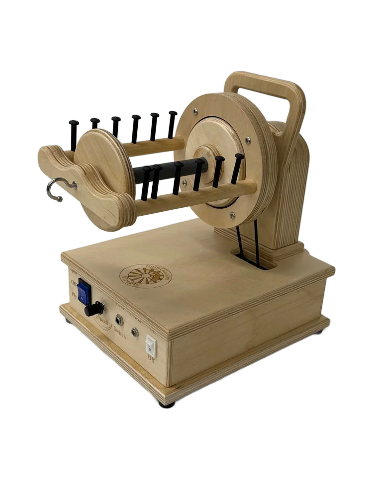 Small wooden toy airplane with black propellers, mounted on a wooden base with switches and knobs, placed on a white surface.