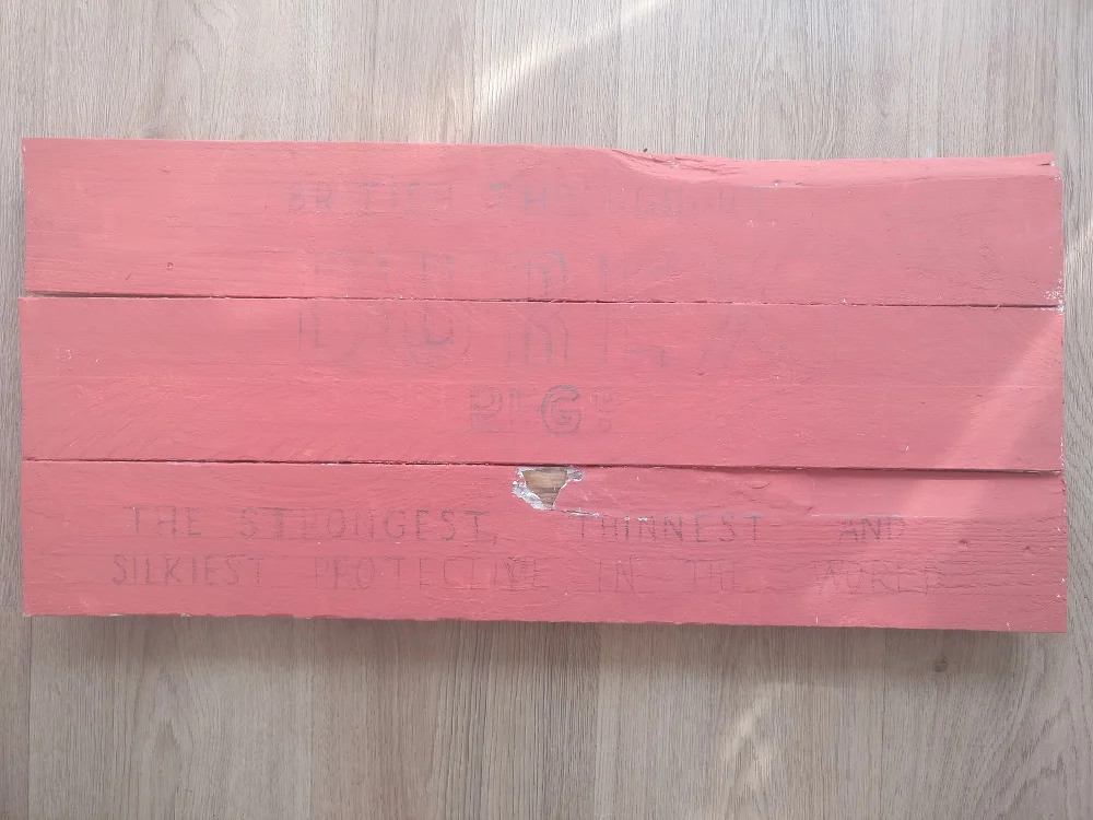 Board built, roughly sanded, base coated and design drawn on. That piece of wood split off happened after painting but just adds to the finished effect.