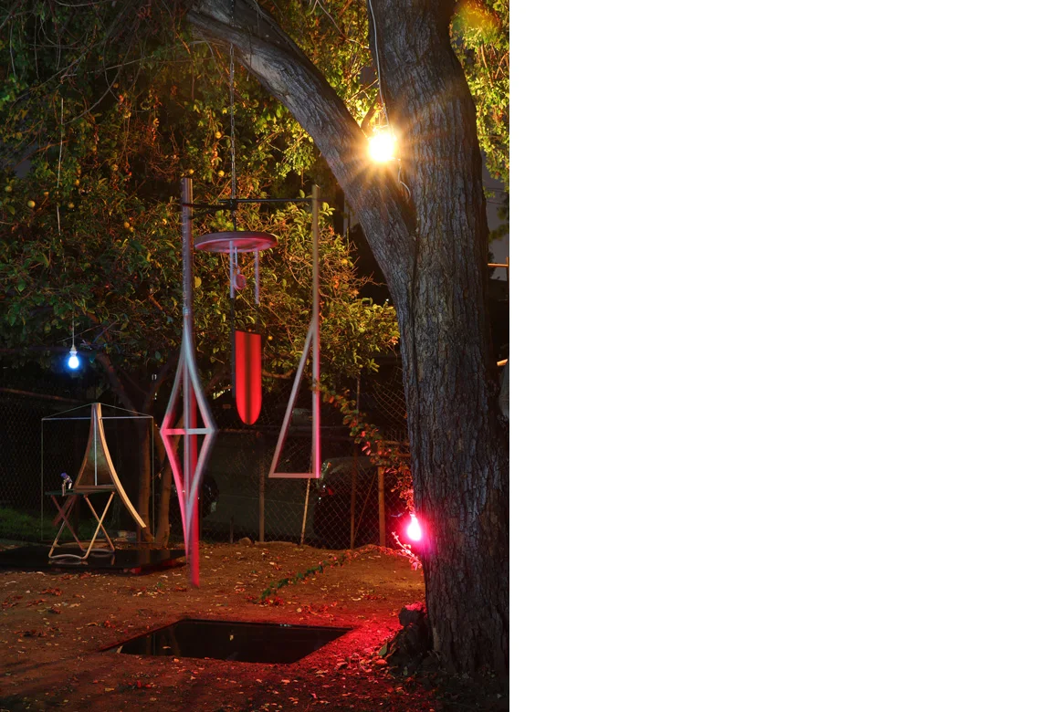 the biggest wheel + variations (mobile over reflection pool) mixed media with locally found objects, 80 x 28 x 23 inches, 88 inches top of mobile to pool, 2 x 35.5 x 35.5 inches pool size, 2015
