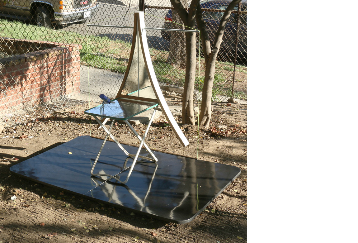    rocking chair + tray table (reflection pool)    mixed media with locally found objects, 43 x 36 x 20 inches, 2015 