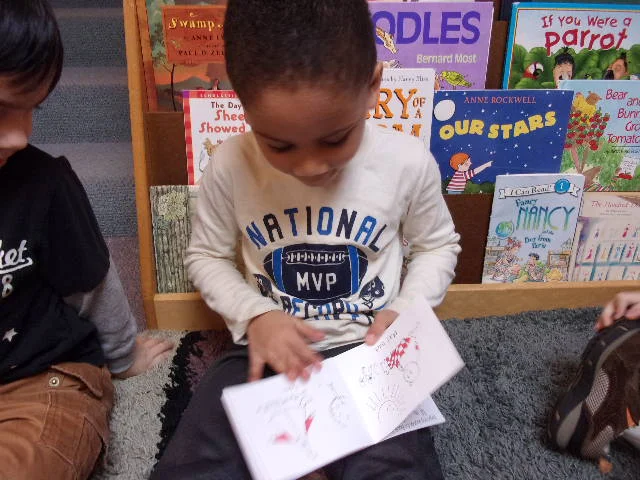 Grant reading a Bob Book to his group.