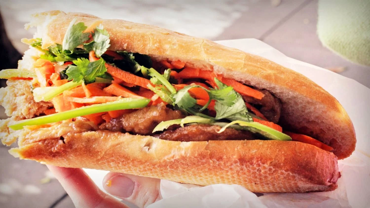 Banh Mi - Cost $1.00 - Bánh mì is the Vietnamese word for bread. Bread, or more specifically the baguette, was introduced by the French during the colonial period in Vietnam. These baguettes are usually stuffed with a local Pâté (a mixture of cooked ground meat and fat minced into a spreadable paste), vegetables and an egg.