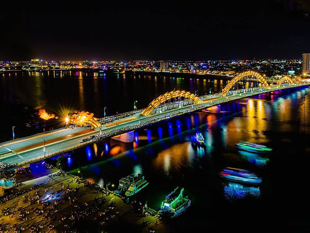 DA NANG - Dragon Bridge - Free to visit - This super cool bridge crosses the Han River and is a ironic 666m long. What's cool about this bridge is every Saturday and Sunday at 9pm, the bridge is closed to traffic for 15 minutes while it breathes fire and water over the surrounding spectators. *We personally recommend visiting 7 Bridges Brewery for an awesome view of the show and a great IPA. This is a much better view than being in the crowds on the street.