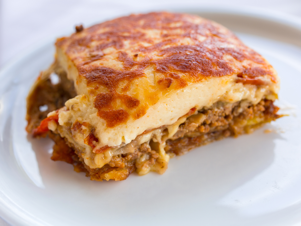 Mousaaka - A world famous, traditional, creamy and juicy dish. Moussaka is essentially the Greeks answer to lasagna. Moussaka consists of tomato sauce which is used to cook minced beef and is subsequently layered with sweet eggplants and creamy béchamel sauce. This is one of our all-time favorite dishes! Best served with a glass of wine and a dessert of Galaktoboureko.