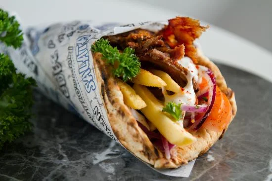 Souvlaki - Souvlaki is one of the most popular Greek foods. You can find this dish on a side street food cart or a fine dining restaurant. The dish consists of seasoned meat and then flavored with tzatziki sauce. In Greek language Souvlaki stands for ‘meat-on-a-skewer even though the most common way to eat a souvlaki is with a pita bread and veggies.