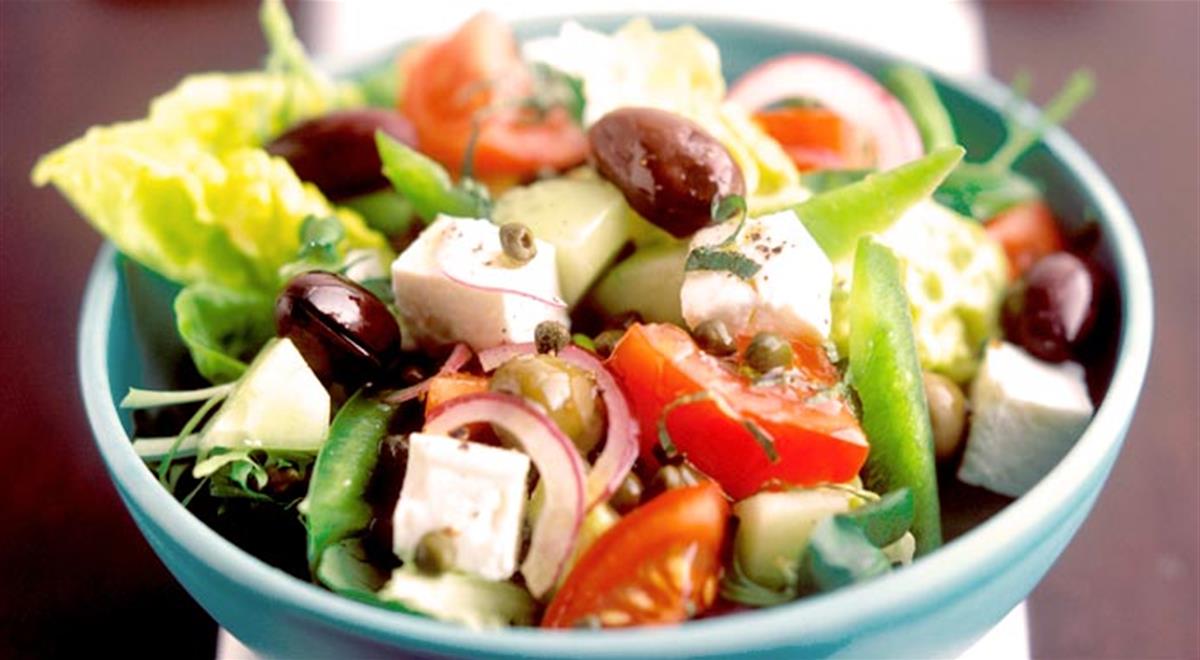 Greek Salad - Maybe the most famous salad in the world, a Greek Salad is tomatoes, olives, onion, cucumber and a large piece of feta cheese and is served undressed. Dressings are usually left for each person to choose: vinegar, salt, pepper or olive oil.
