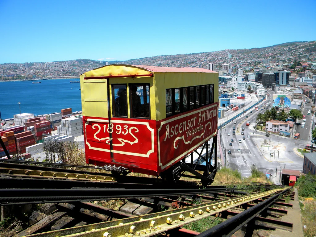 Ride the Historic Funicular Elevators - Cost $0.50 - Valparaiso is a city made up of 45 hills. To make getting around Valparaiso easier, the city has installed funiculars (huge, fancy elevators). The best known is the Ascensor Concepción funicular which dates back to 1883. Our favorite is the Ascensor Reina Victoria funicular, which arrives to a view the "iconic Valparaiso postcard shot."