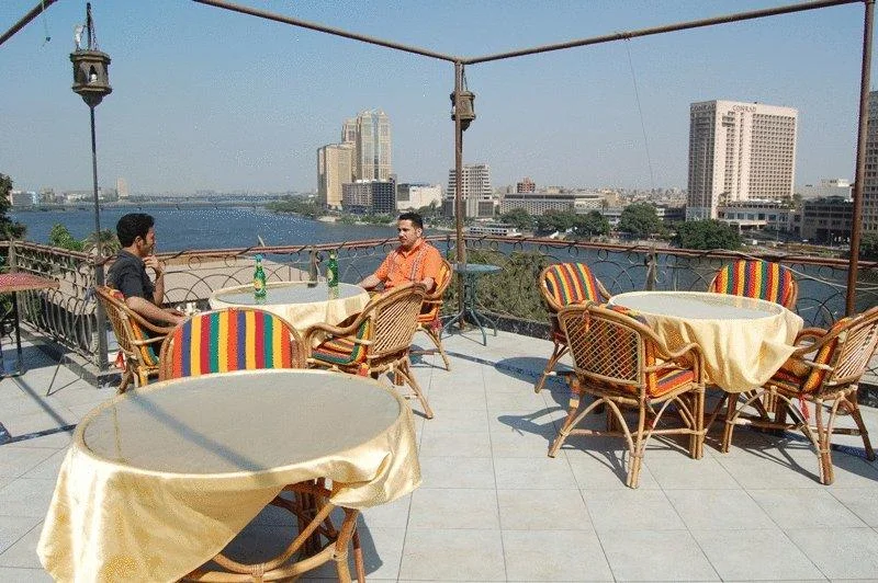 Cafes and Shisha - Rooftop (Zamalek): $$ - Stay up late with friends and watch the sun set over the Nile from this rooftop perch. Order a shisha and some snacks, and you will be set for hours.
