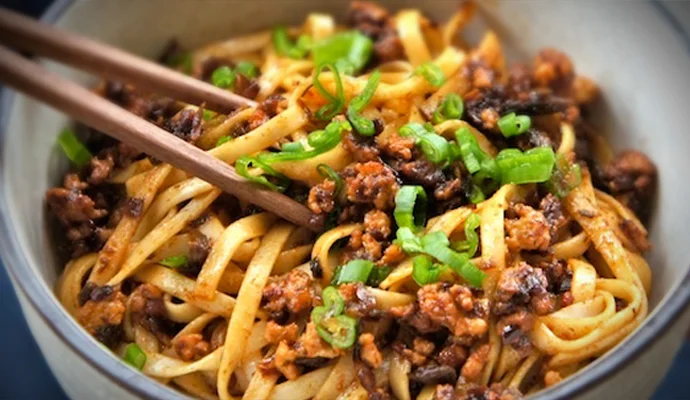 Dan Dan Noodles (dan dan mian 担担面) – If you’re looking for cheap food nothing will fill you quite as well as a big bowl of Sichuan Beef noodles. Like most of the food on this list, it’s oily and spicy but the soup is great (pro-tip, blow on the soup as you’re tipping it to push away the top layer of oil) and at 10-12 Yuan for a big bowl you can’t go wrong. Dan Dan Mian is a smaller dish of dry – without broth – noodles dressed with minced pork, spring onions, oil and peanuts. It’s totally delicious but not always available by that name in noodle places. If you ask for gān bàn miàn (干拌面)you’ll usually get a rough approximation, possibly without the peanuts.
