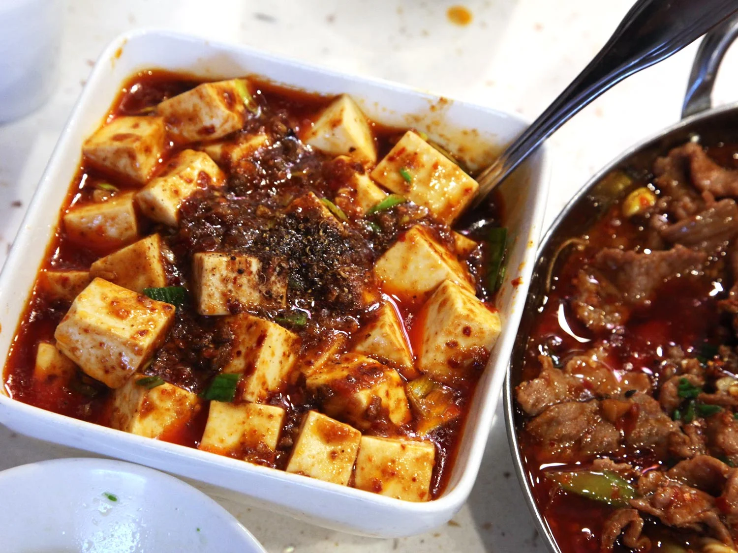 Mapo tofu (má pó dòu fu 麻婆豆腐) – Possibly the best tofu dish ever, mapo tofu is cubes of tofu in a slick, oily, salty, savory and often quite spicy sauce with minced pork. Chen Mapo Tofu restaurant in Luomashi is famous for their version but most restaurants will serve one that is at least half-decent. Averages around 20-40 Yuan.