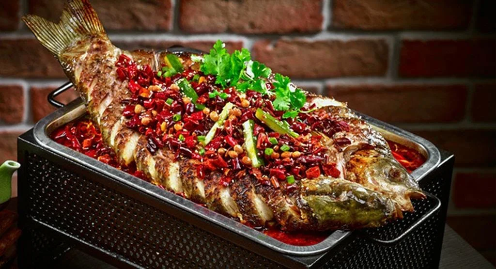 Roast Fish (Kao yu烤鱼) – My favorite dish in Chengdu. Grilled whole until it’s crispy and then submerged in spicy oil with vegetables. Expect to pay 100-150 Yuan depending on the size of the fish.