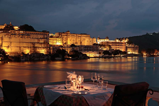 Ambrai Restaurant - Ambrai serves excellent multi cuisine delicacies and is ideally located on the banks of Pichola Lake with panoramic view of the many temples, forts and palaces. Though this is an “expensive” restaurant in the city, a dinner for two (including a bottle of wine) will set you back only $40-$50. Reserve a table for sunset and watch the lake city transform.