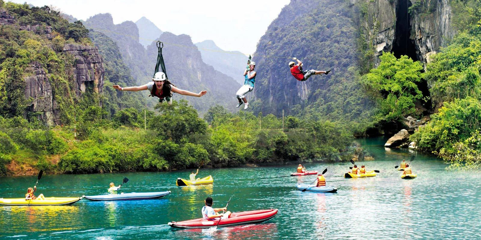 Hang Toi (Dark Cave) - $20 - A real adventure cave, now very popular! There are no lights in the cave, and after zip-lining across the river, you swim through the cave with your head-torch leading the way, then explore a muddy side passage before kayaking back across the river. You can explore this spectacular cave on our National Park tour or independently. The other entrance to Dark Cave is many kilometers away in the Abandoned Valley and can be seen on the Abandoned Valley Trek. Hang Toi is a wonderful and very accessible example of the beautiful caves that are found throughout this region.