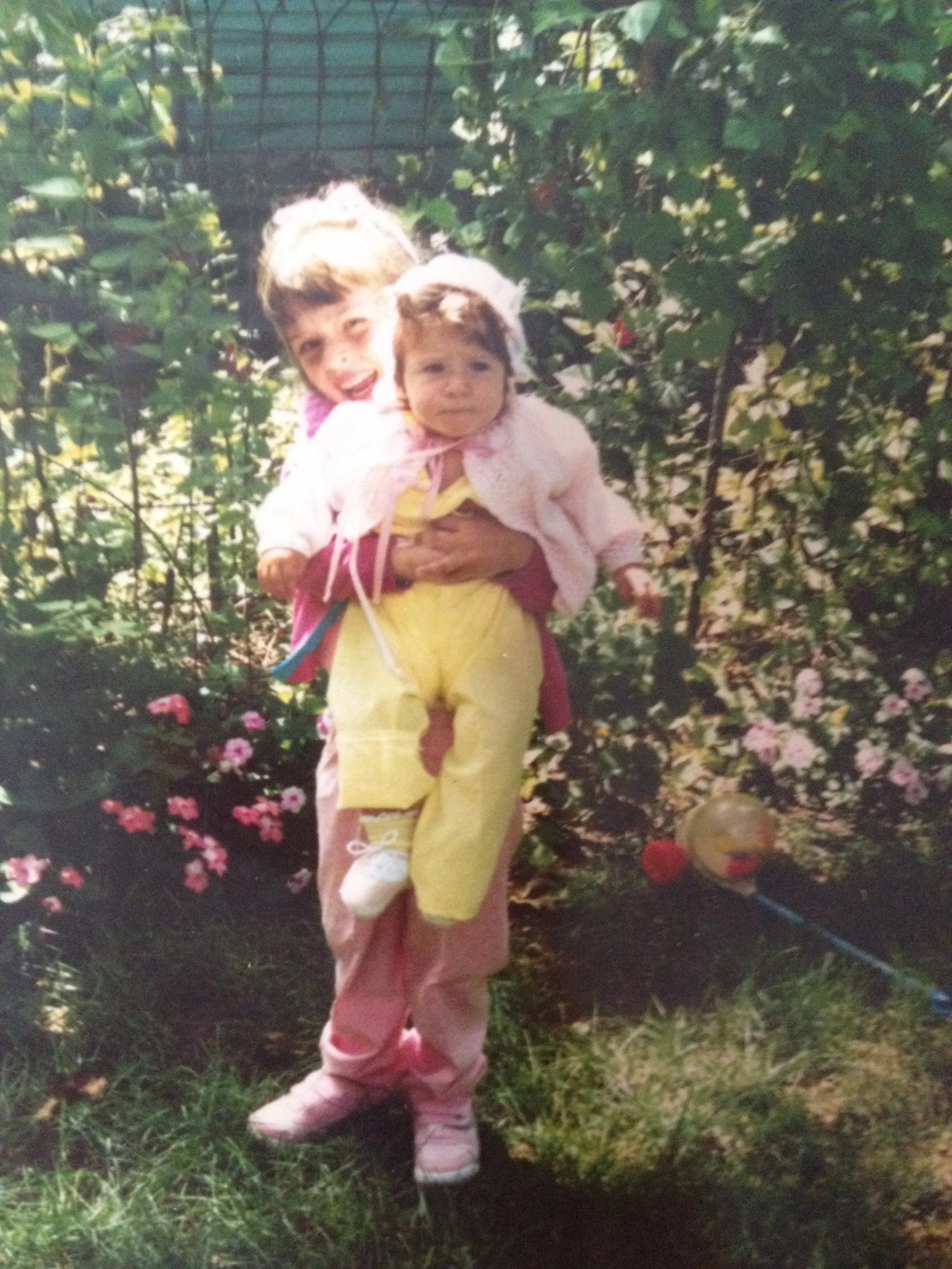 Is this the proper way to hold a baby? Also, I don't know why this photo is squished. Internet, please help! One more also -- this is me and my sister. 