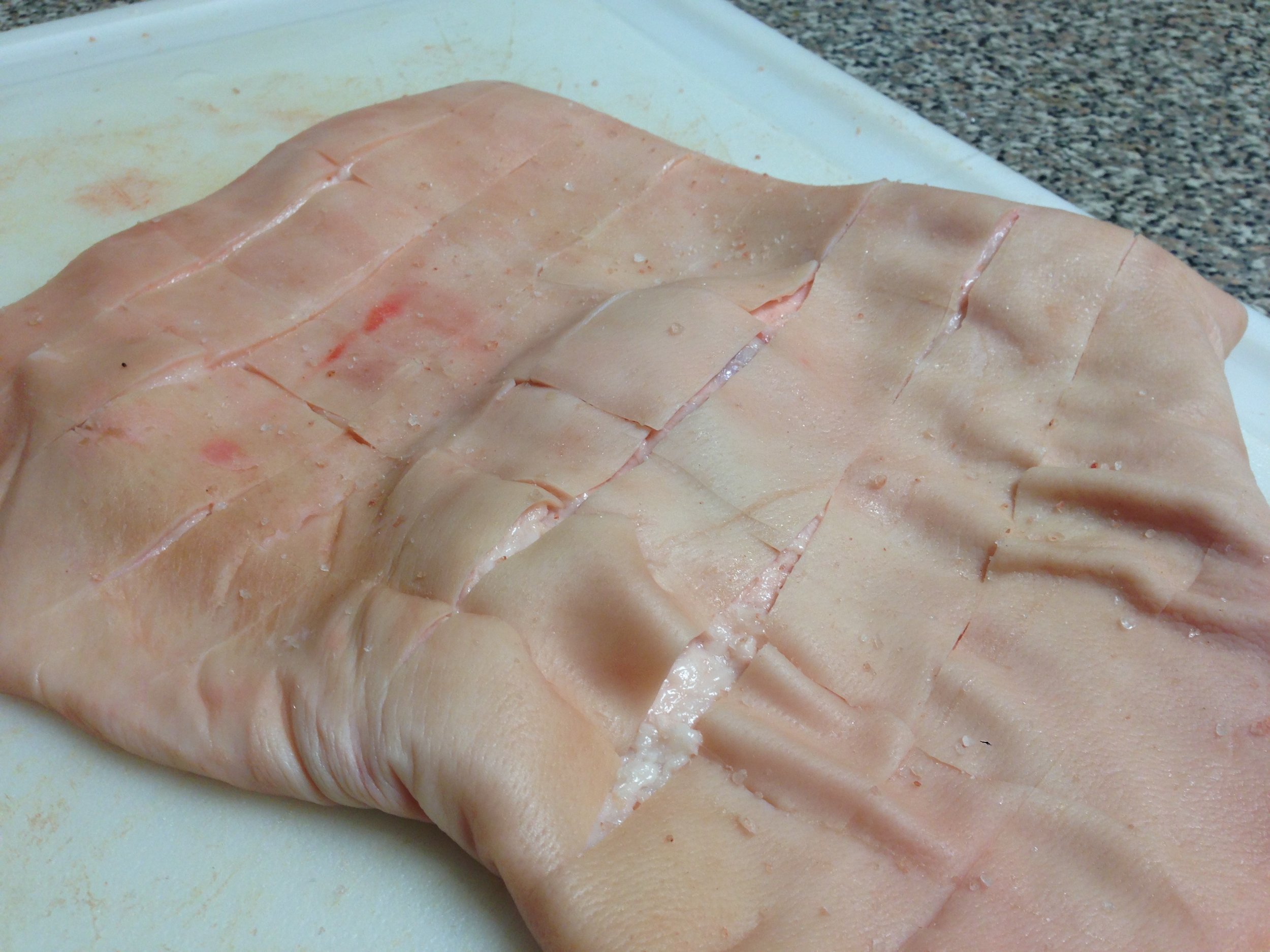 The diamond cuts will help you serve the pork skin.