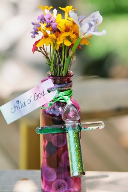 Child_of_God_vase_with_flowers.jpeg