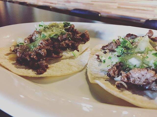 Happy hour tacos. Carne asada, house made salsa verde, onions and cilantro on corn tortillas. So simple but so good!
