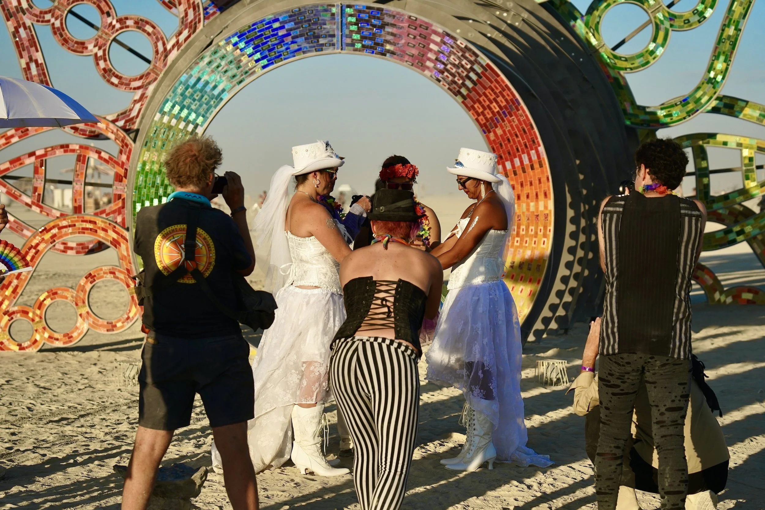  Many people get married on the Burning Man playa, often using the installations as a backdrop. 