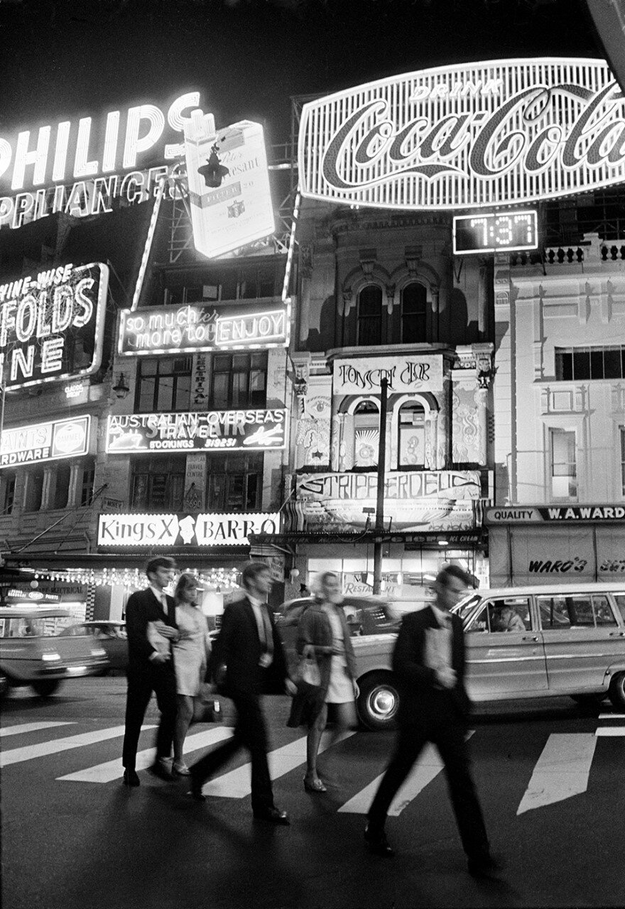 Pedestrian crossing Darlinghurst Road outside the Tabou nightclub at night,  Kings Cross 1961