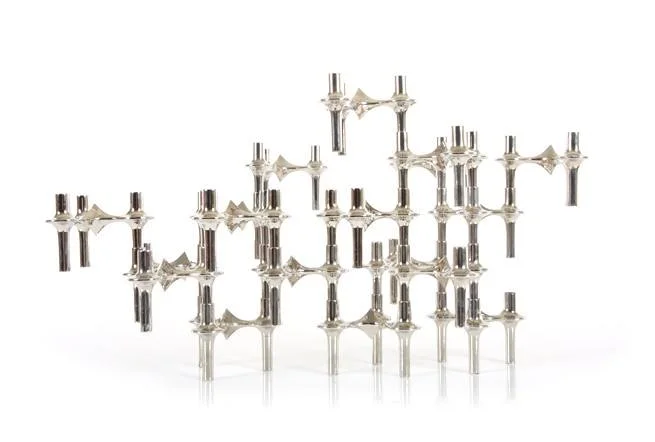 These iconic 1960s BMF Nagel chrome candlestick holders are available from Mr. Bigglesworthy . The modular candle holders are sculptural in form and interchangeable, allowing you to build various configurations of your own design. 