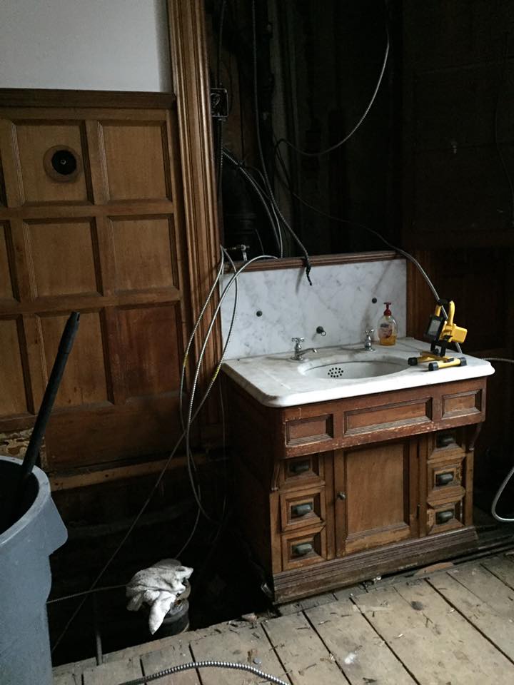 Removal of the flooring, toilet and original lighting.
