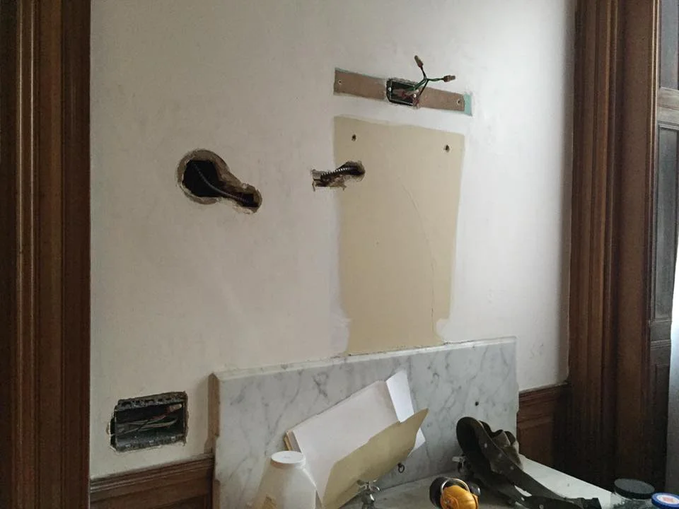 Removal of the original lighting and new outlet location.