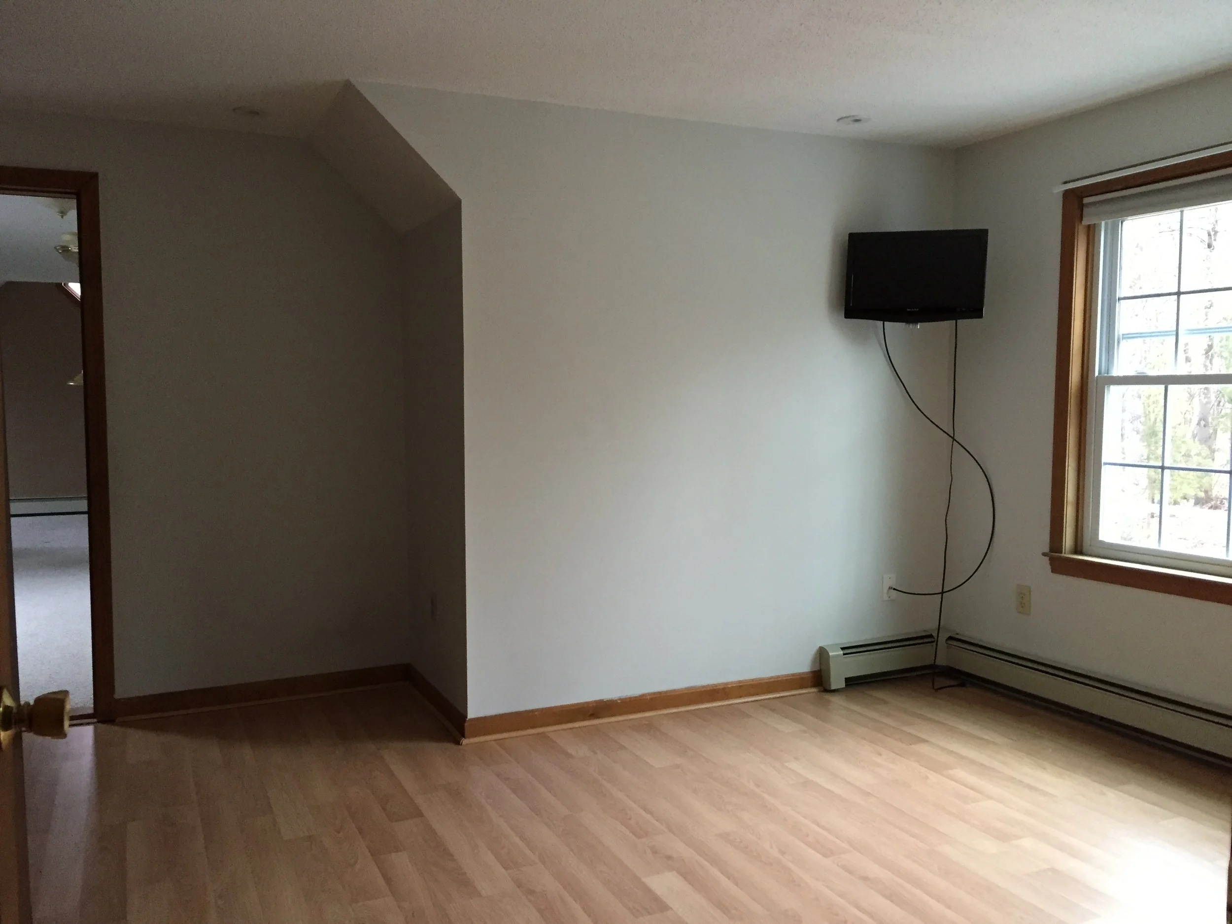 BEDROOM 1 - BEFORE PAINT + WITH LAMINATE FLOORING