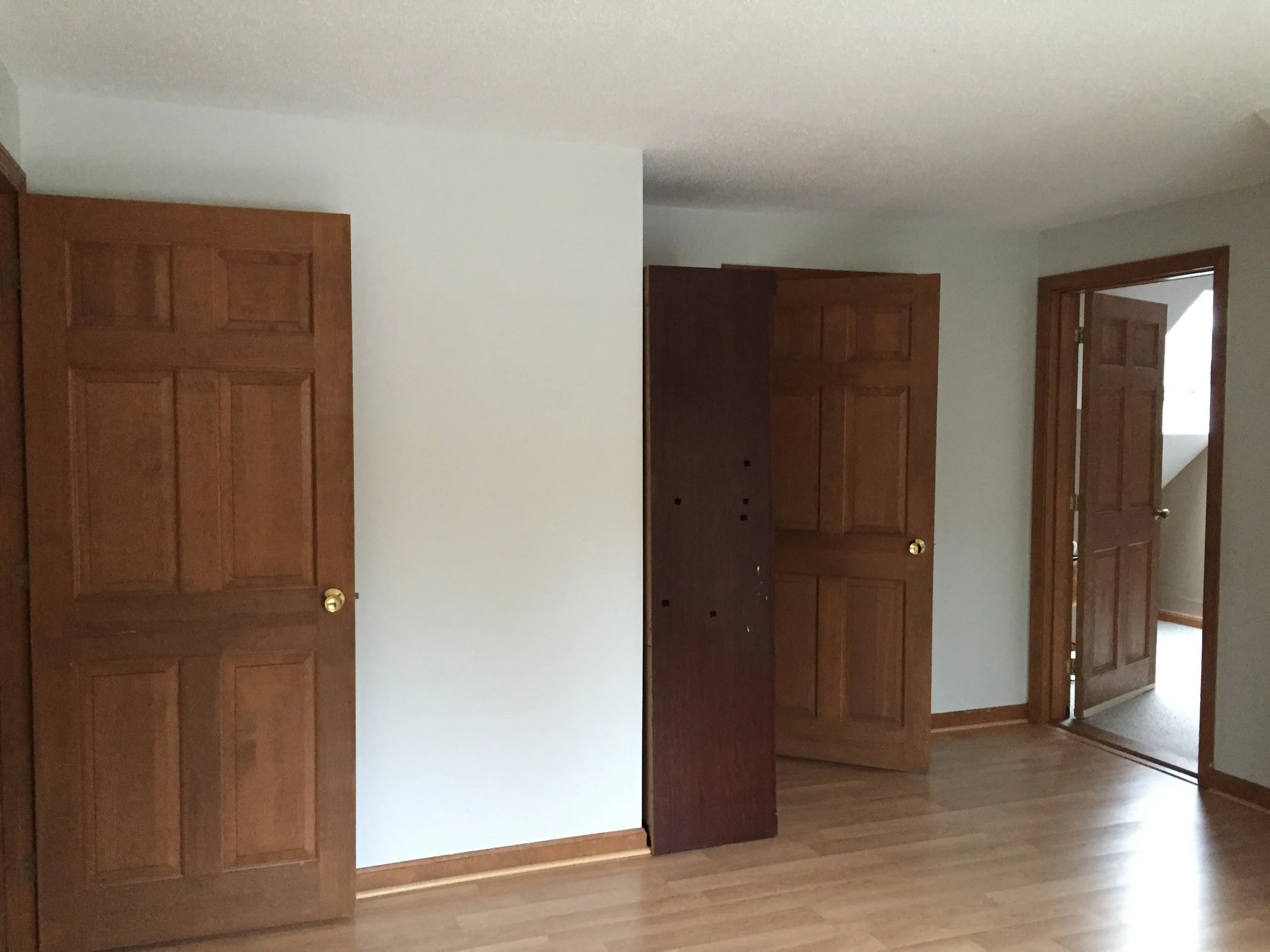 BEDROOM 1 - BEFORE PAINT + WITH LAMINATE FLOORING