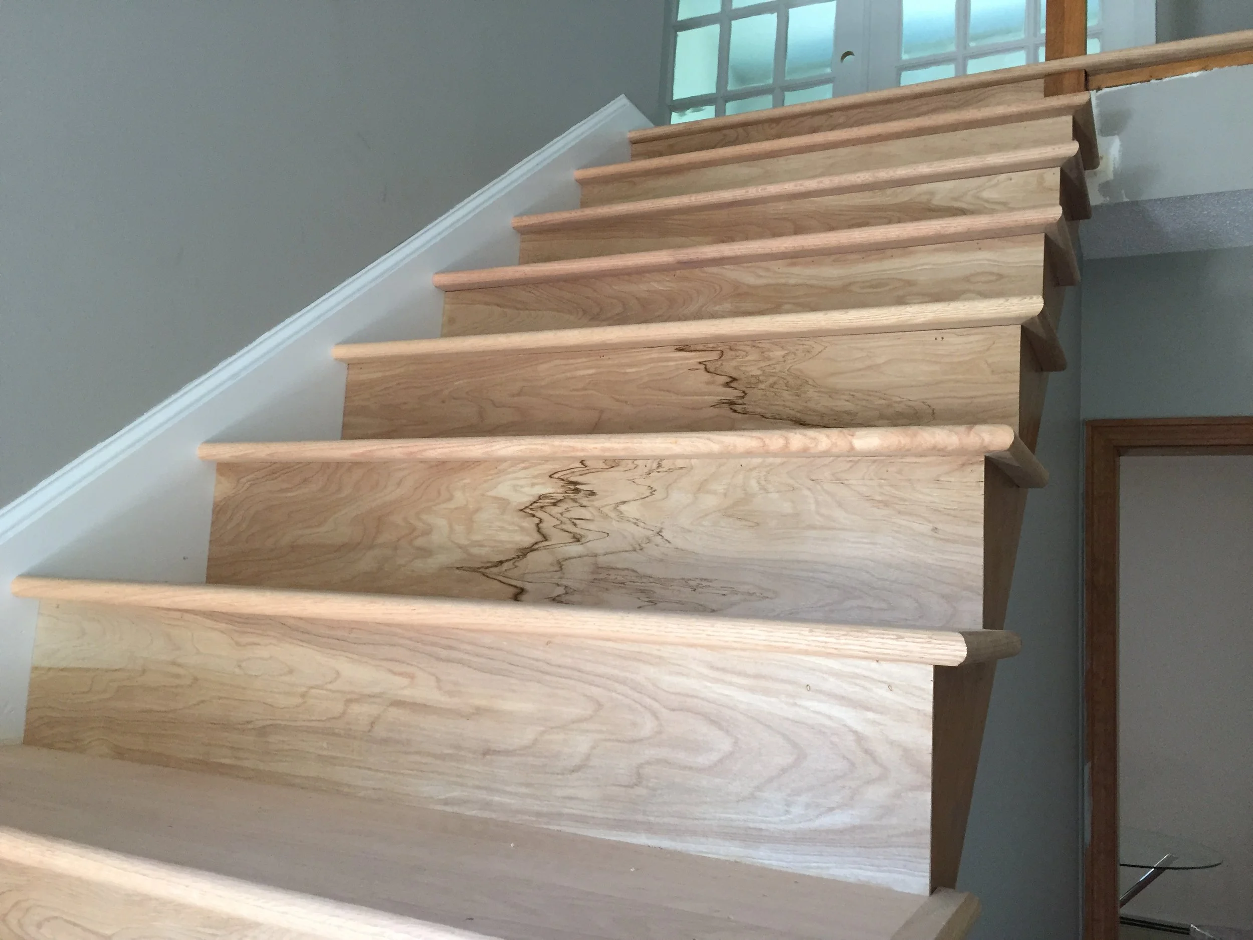 PROGRESS - Entry Stairs closeup of red oak boards (unstained)