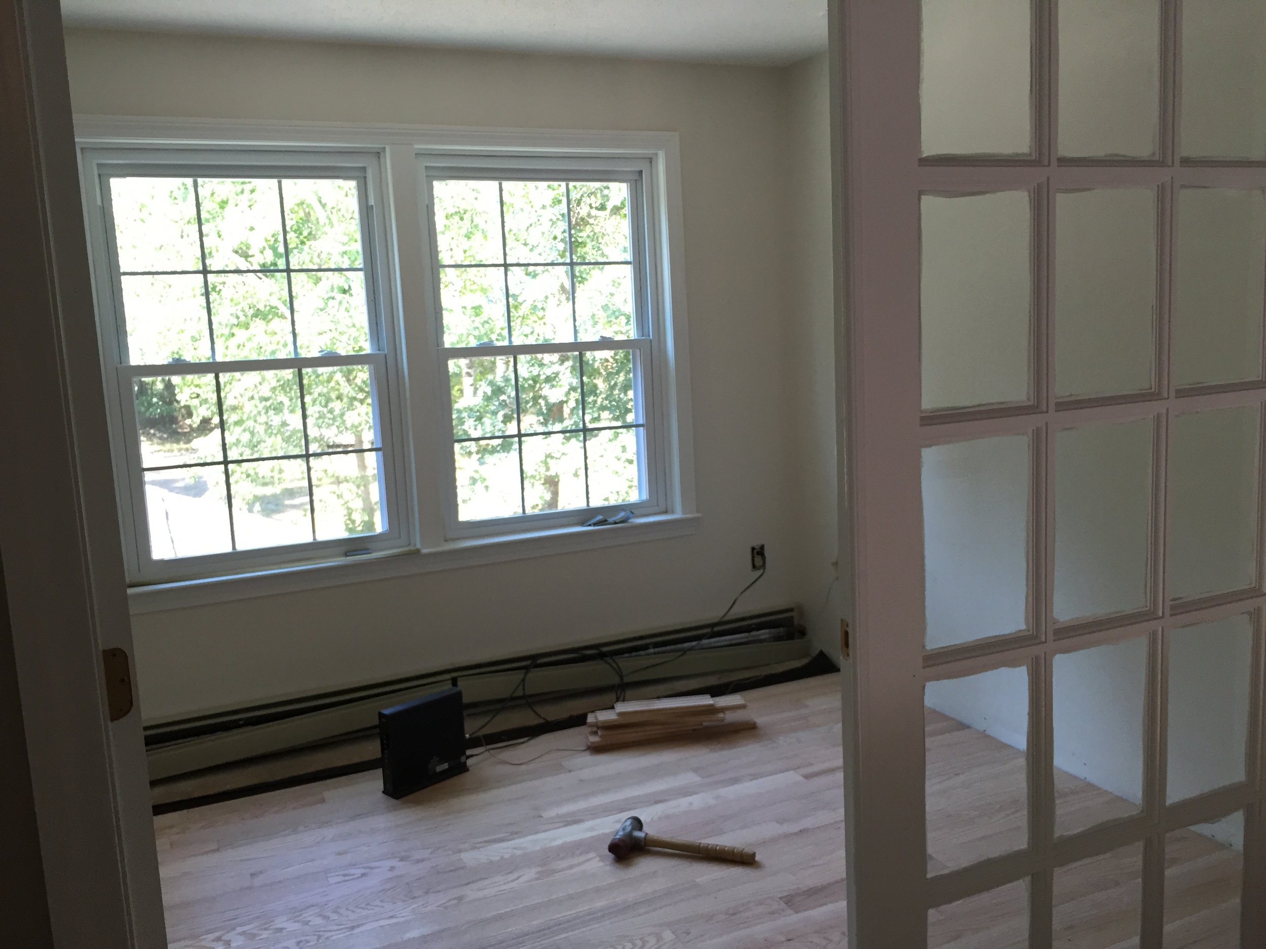 AFTER - Office with new red oak flooring installed (unstained)