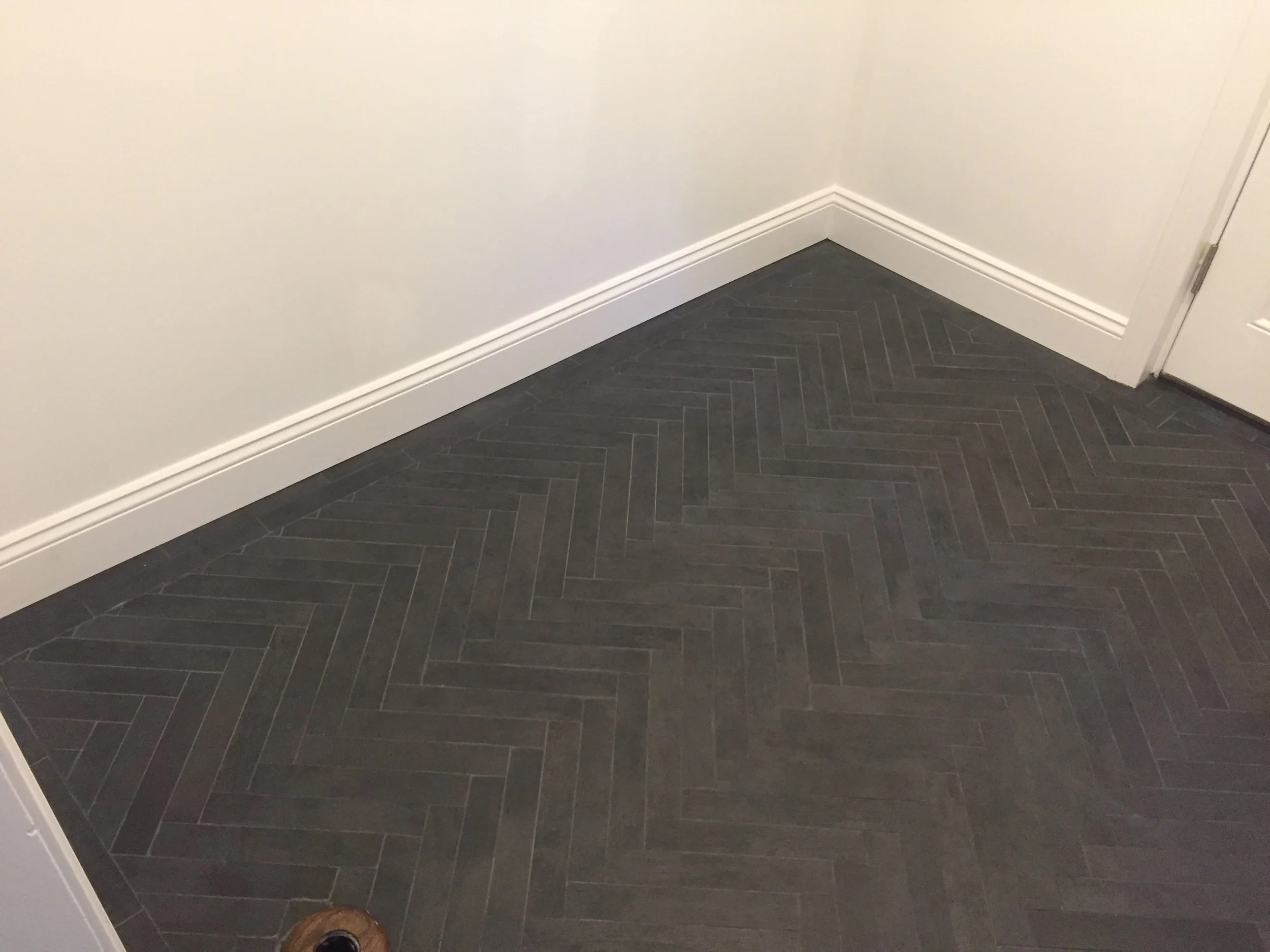Tile Complete with Plastered Walls, Paint and Baseboard