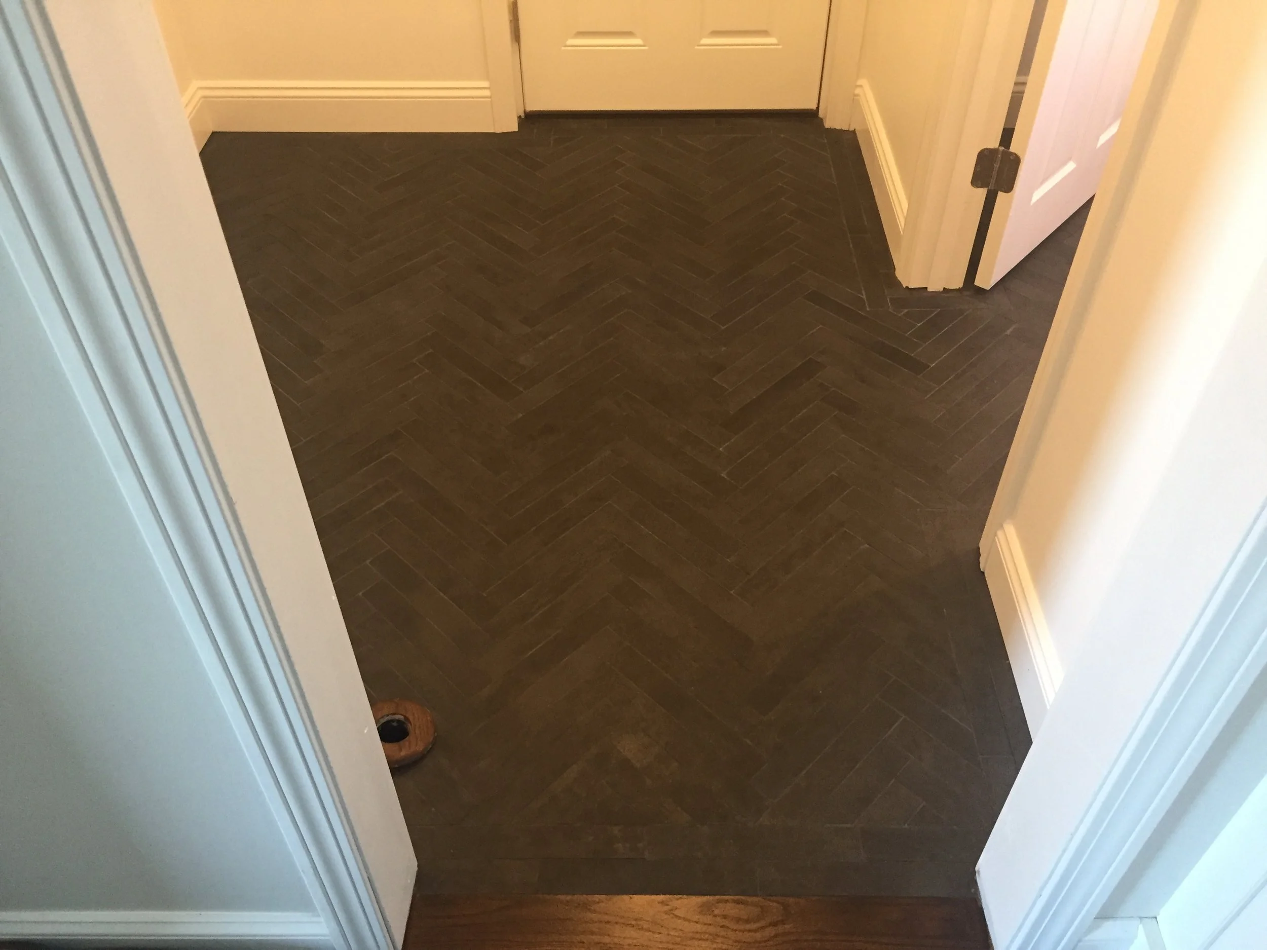 Tile Complete with Plastered Walls, Paint and Baseboard