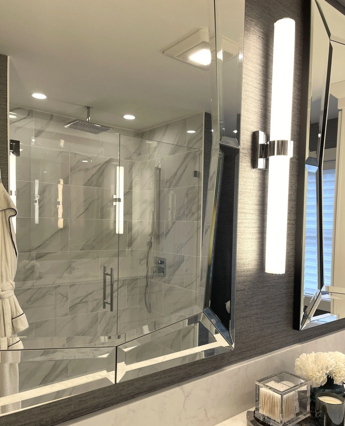 A peek through the mirror. Love how the vanity reflection perfectly frames the shower - little design moments like this make a space feel layered, intentional, and elevated.⁠
.⁠
.⁠
.⁠
#mydesign #InteriorDesign #BathroomDesign #MirrorView #ReflectedBe