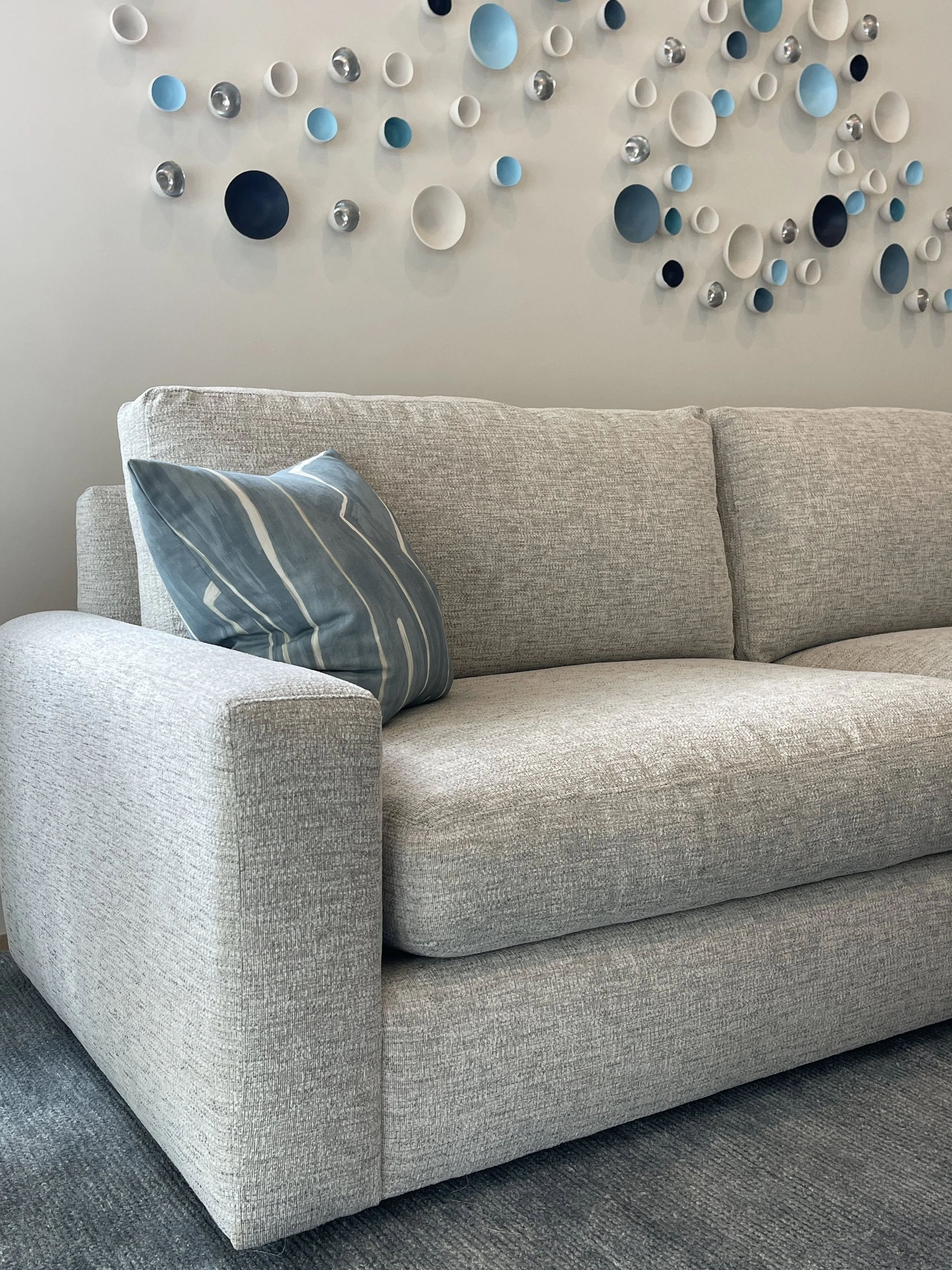 Closeup of Wall Art Sculpture Pods over Sofa