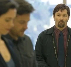 A couple menaced by a stranger from his past 