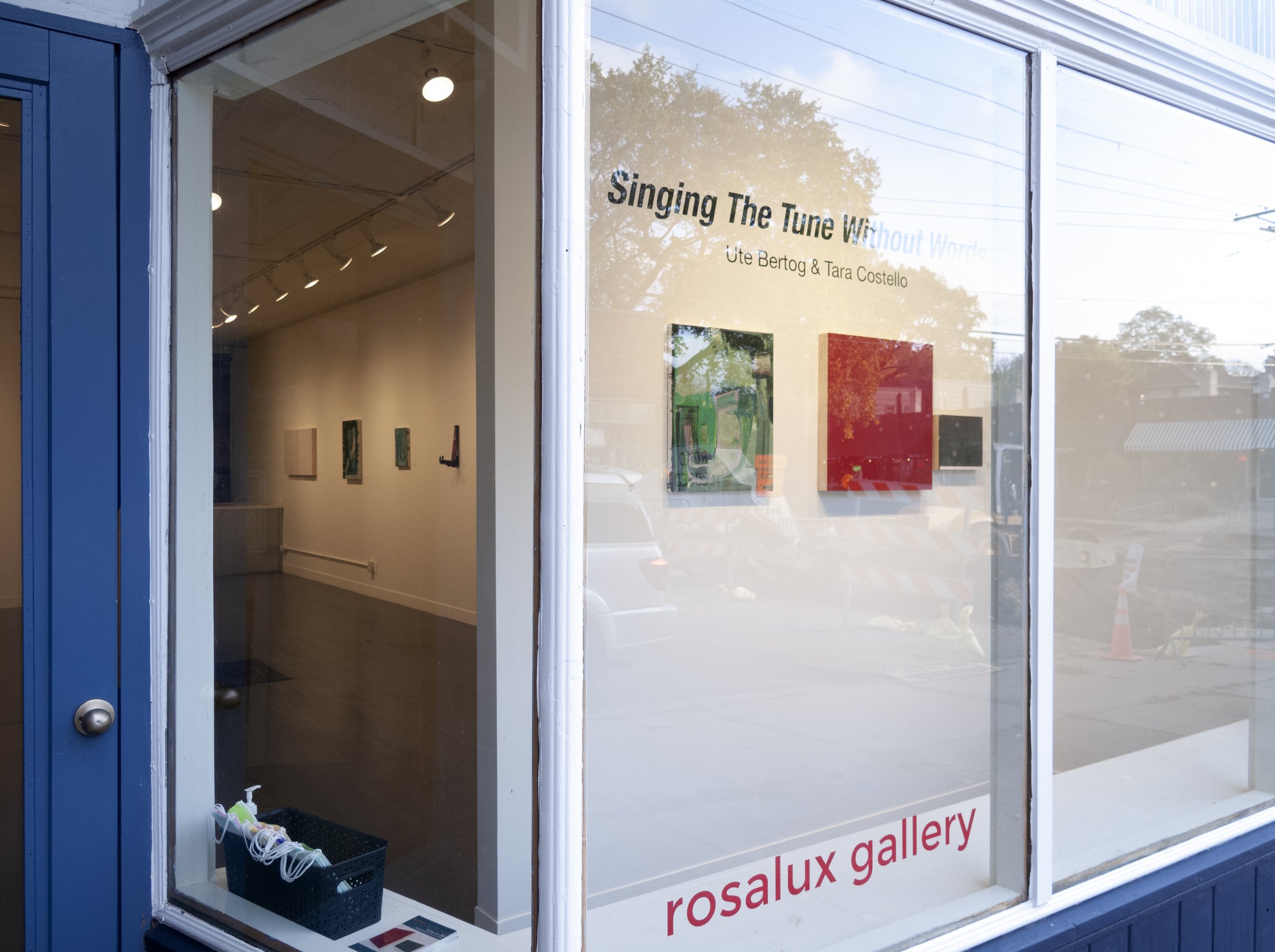  Front window of  a two-person show   Singing the tune without words   with works by Ute Bertog &amp; Tara Costello  left: Ute Bertog, Wanderlust, 2021  right: Tara Costello, 2021 