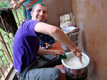 Helping a family cook ugali for dinner!