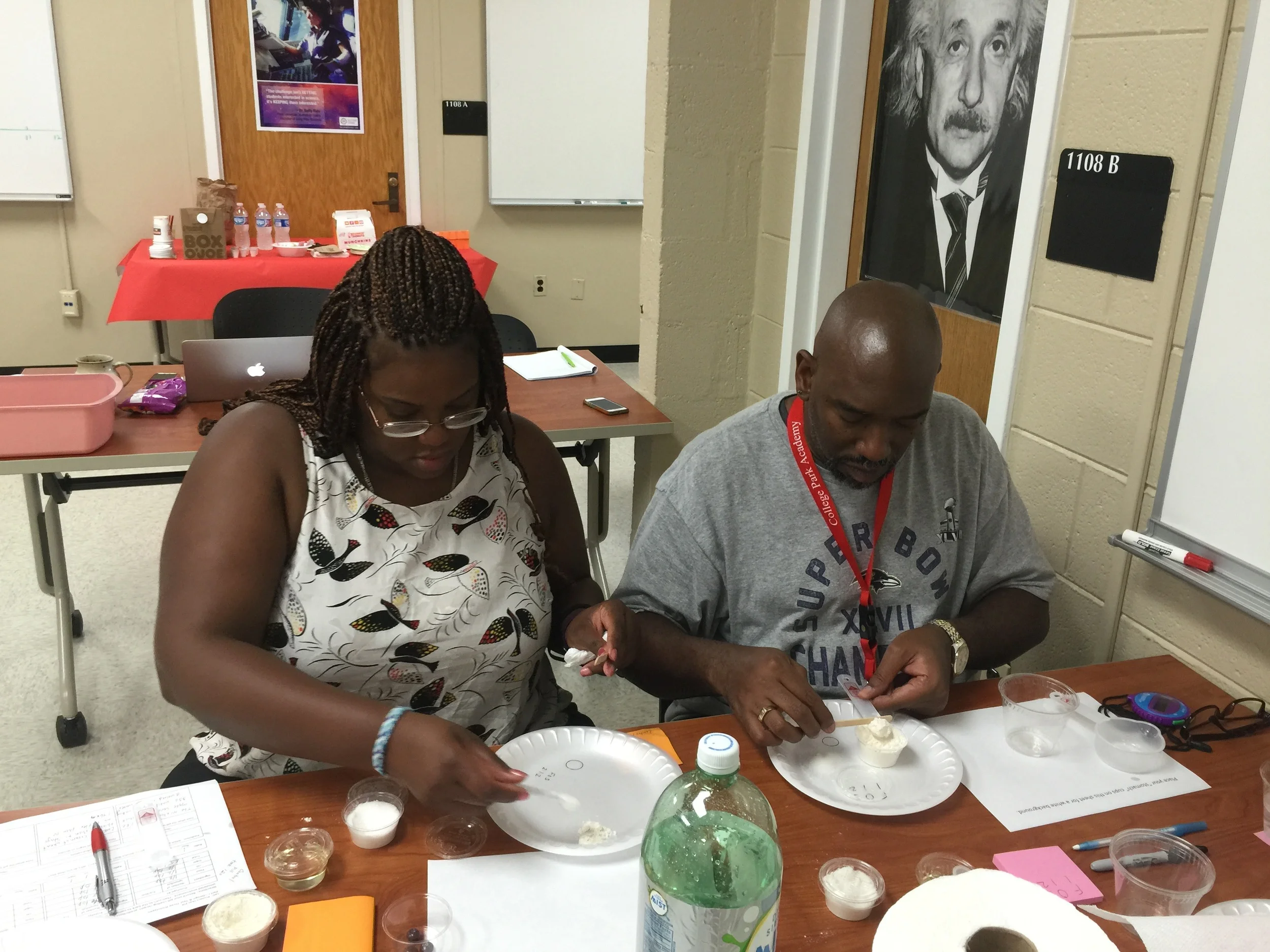 Photo: Left to right; Holly Riley, Northwestern High School and Juan Foreman, College Park Academy, participated in the Learning Community Day for collaborating teachers. Teachers performed the tasks with the lens of teachers and student learners.