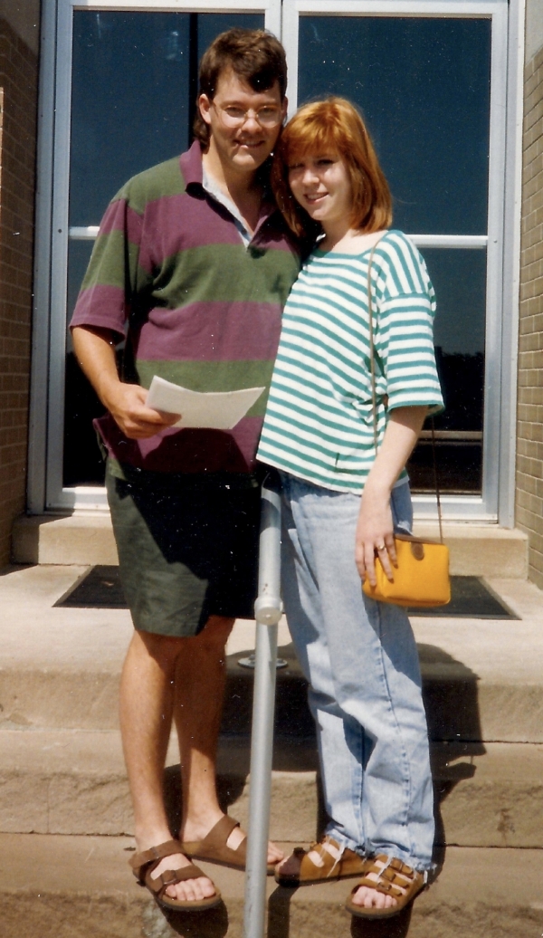 Courthouse cuddling, marriage license in hand
