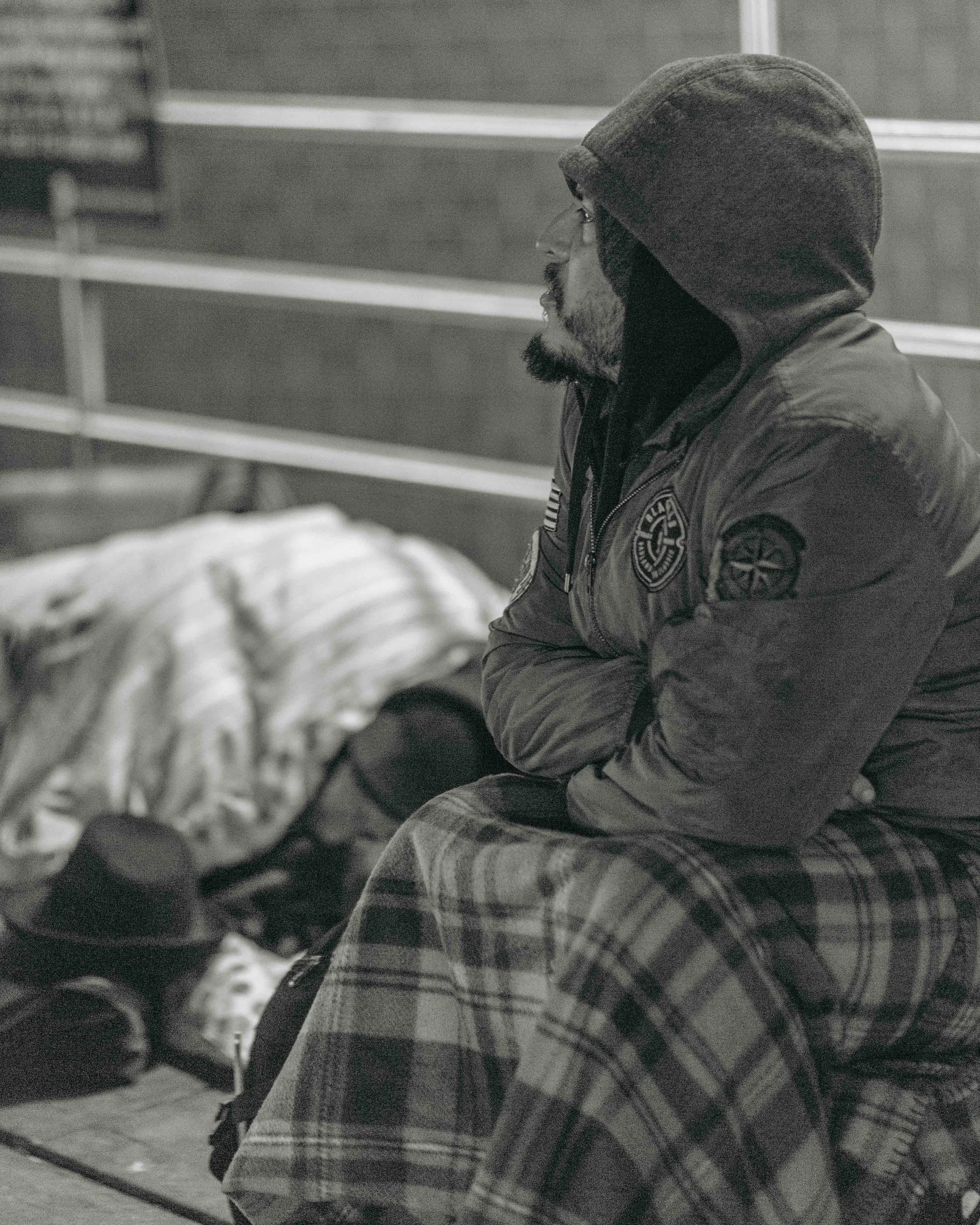 Union Square, NYC. This man is often found right outside of Food Emporium. There is a large protected area just outside of the store and subway entrance, making it a popular place for people to camp out. There's typically around half a dozen people who sit outside the subway entrance there.