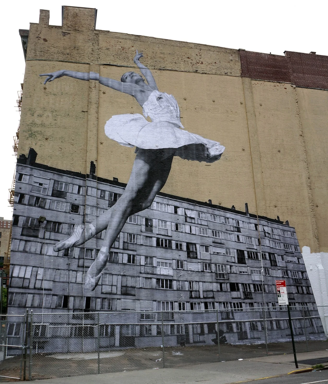 Photograph by Daniel Weintraub for streetartnews.net in " JR Brings a New Mural to the Streets of New York City, USA ," 8.19 2015