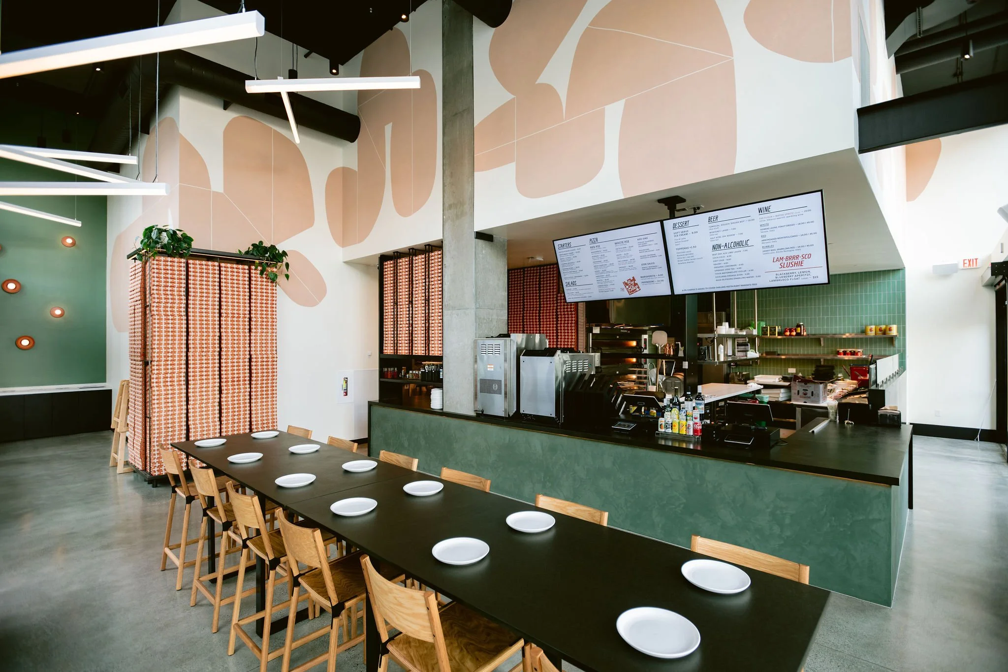 Interior of Flour + Water Pizza Shop Oakland featuring dining counter seating and open pizza kitchen, constructed by Cookline